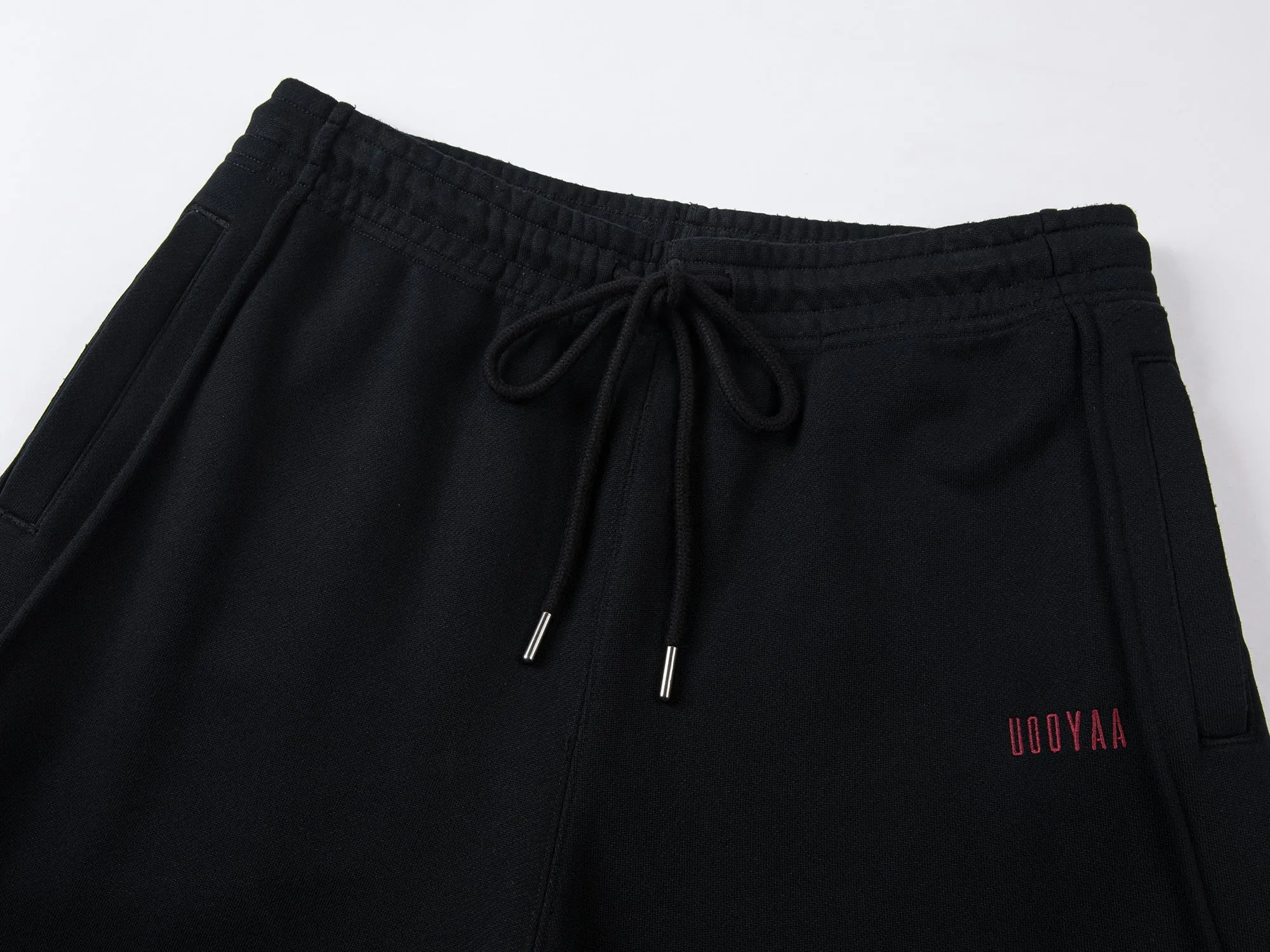 Architectural logo curved knife sweatpants